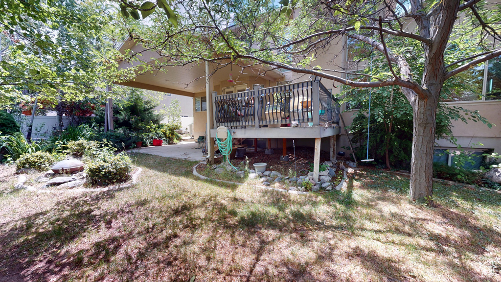 Rear view of house with a deck