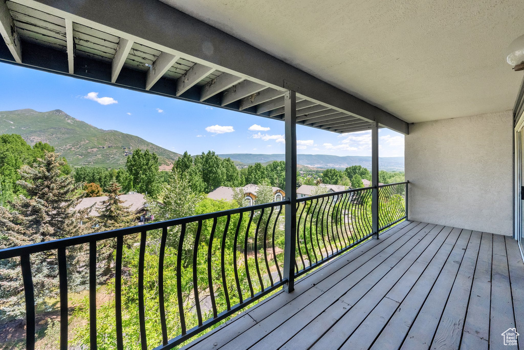 Wooden deck featuring a mountain view