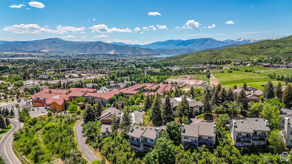 Aerial view of residential area featuring a mountainous background