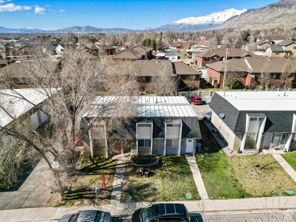 Birds eye view of property with a residential view and a mountain view