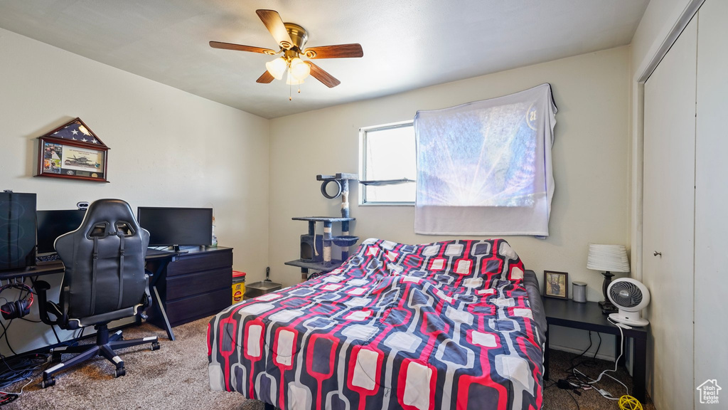 Bedroom with carpet floors and a ceiling fan