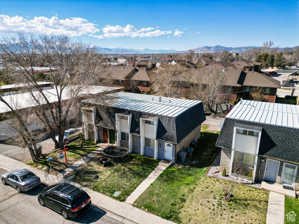 Drone / aerial view with a residential view and a mountain view