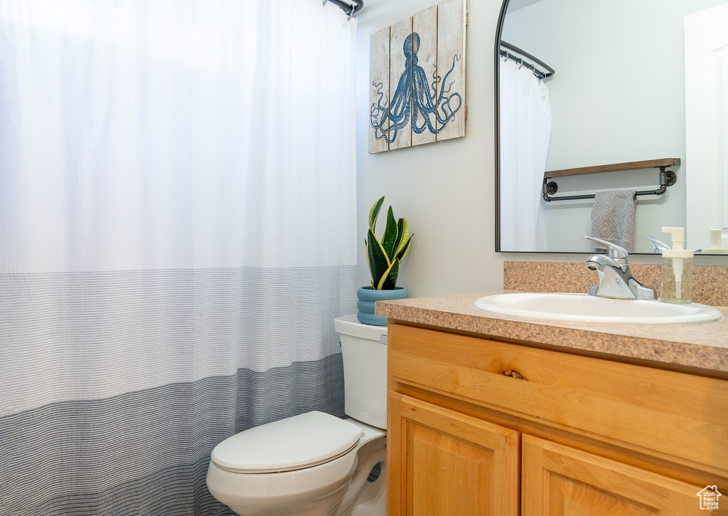 Bathroom with toilet and vanity