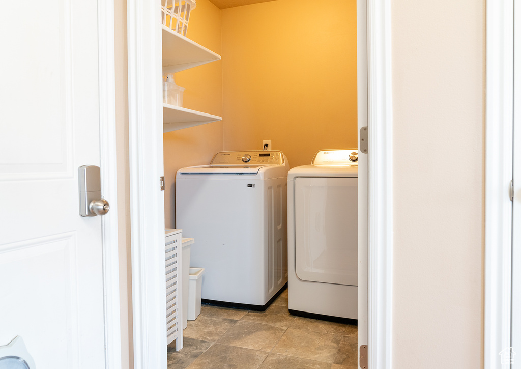 Laundry room with independent washer and dryer and laundry area