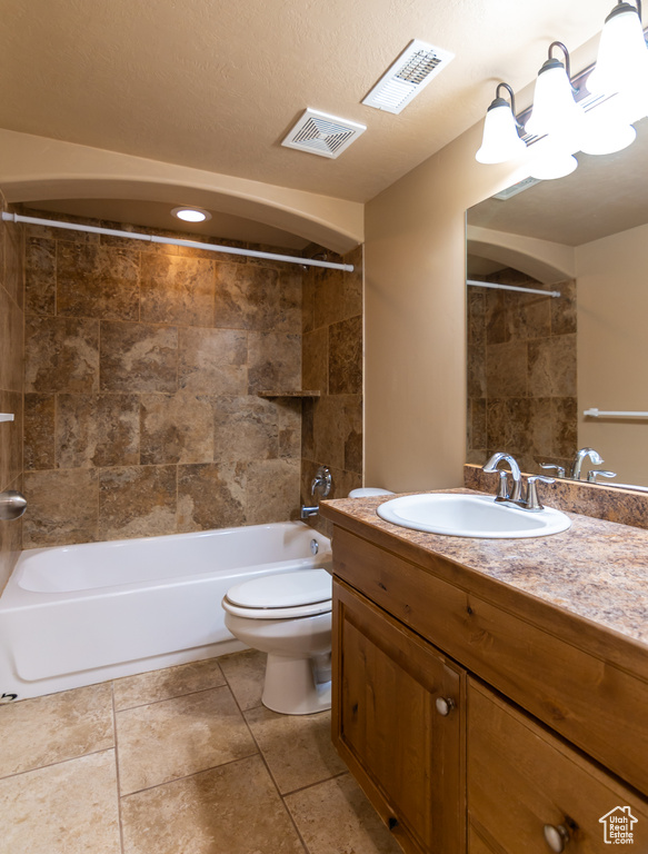 Full bathroom with vanity, visible vents, toilet, and bathing tub / shower combination