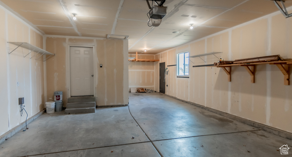 Garage featuring a garage door opener