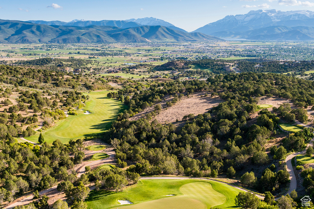 Drone / aerial view featuring view of golf course and a mountain view