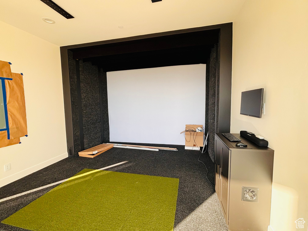 Game room featuring carpet floors and baseboards