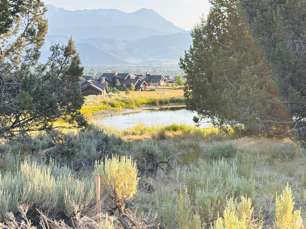 View of mountain background featuring a nearby body of water