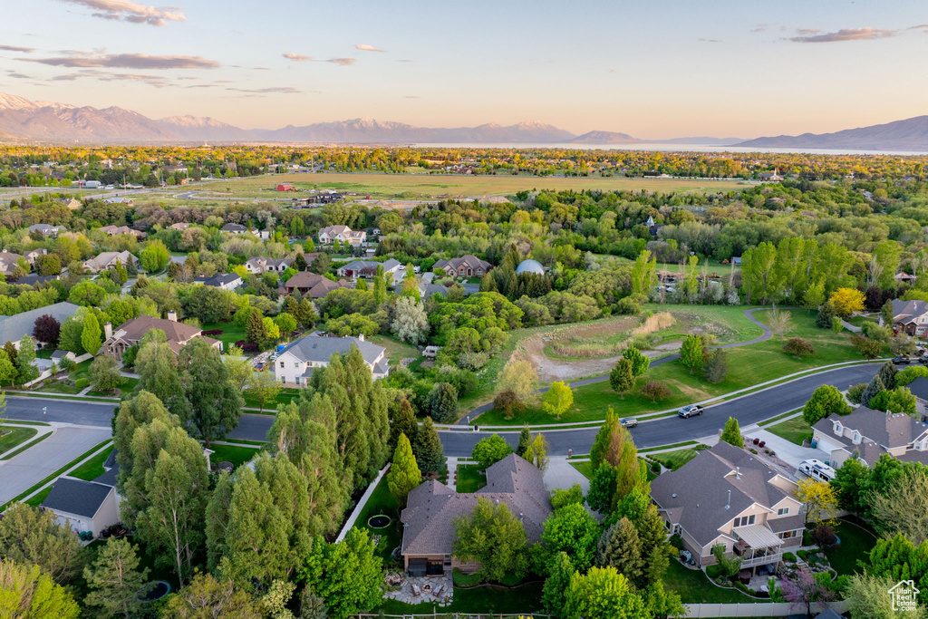 Aerial perspective of suburban area with a mountain backdrop