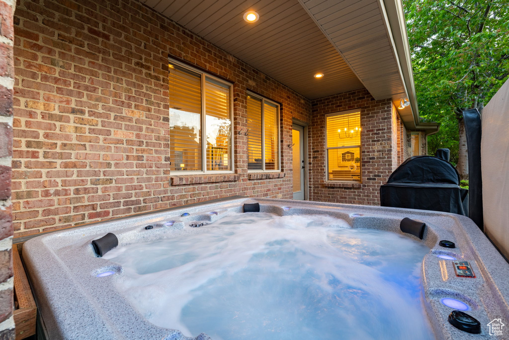 View of patio featuring a hot tub