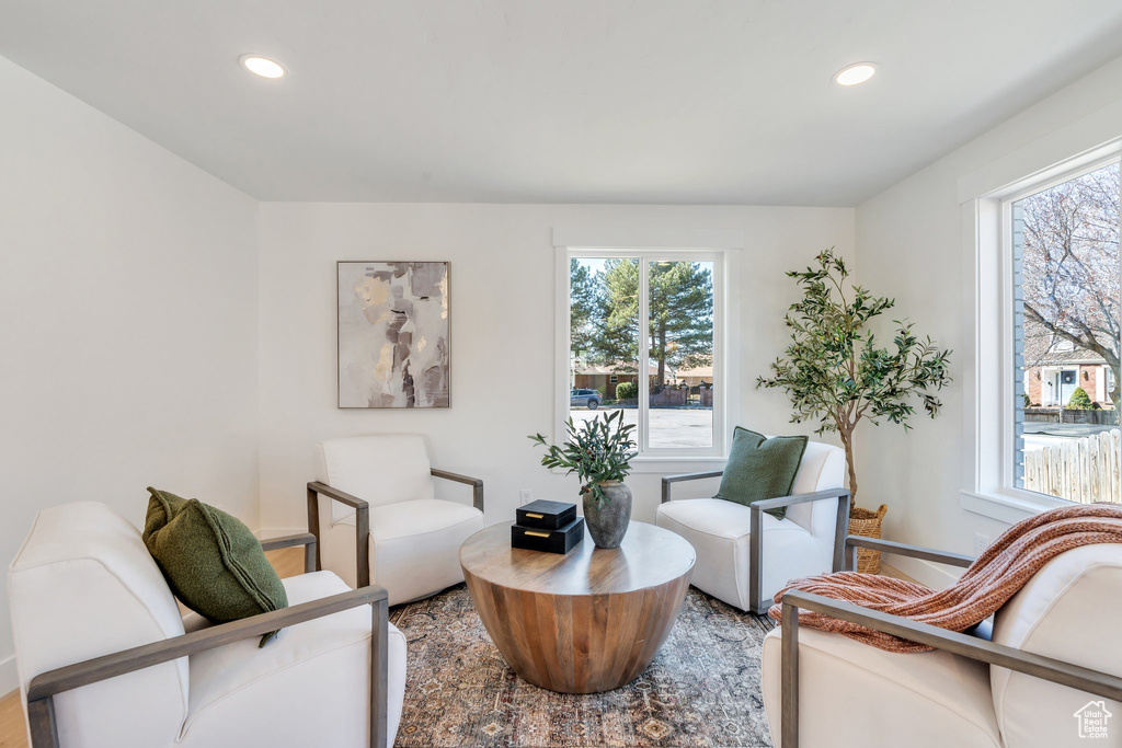Living area with plenty of natural light and recessed lighting
