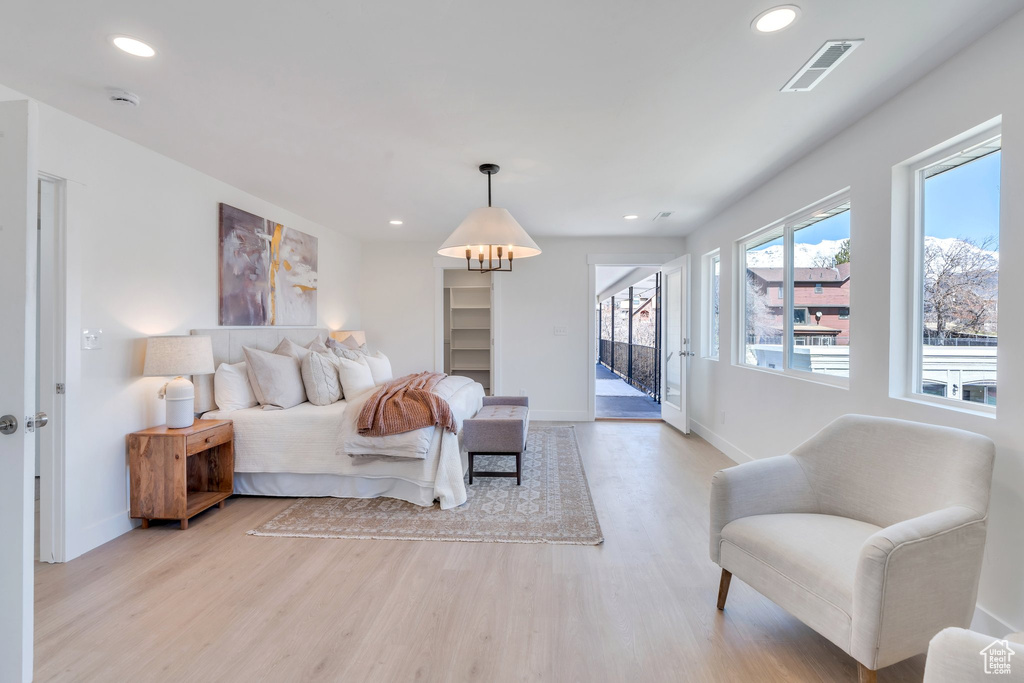 Bedroom featuring recessed lighting, access to exterior, visible vents, and light wood-style floors