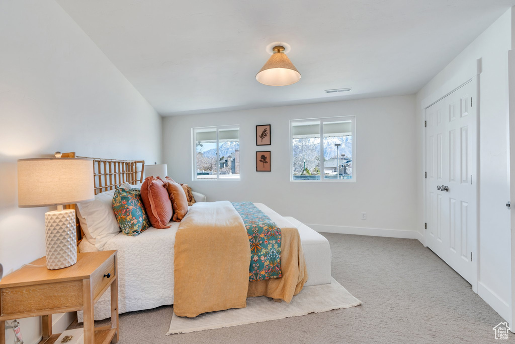 Bedroom featuring baseboards and carpet flooring