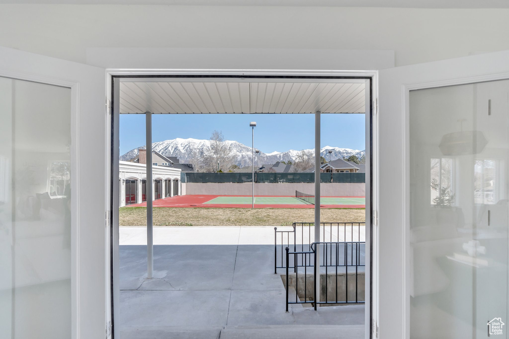 Entryway with plenty of natural light and a mountain view