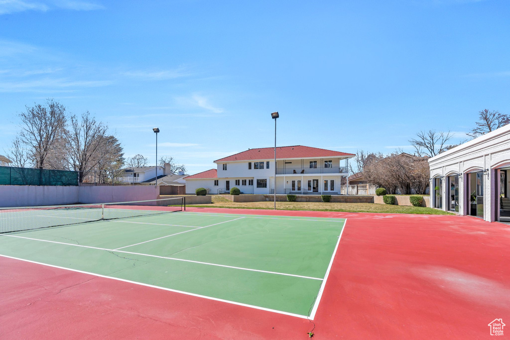 View of sport court featuring fence