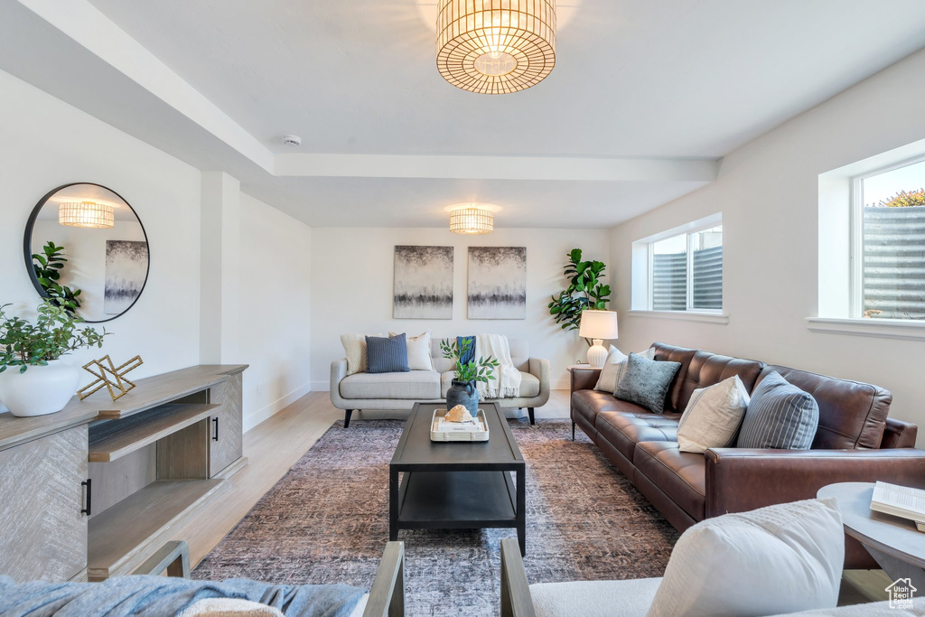 Living area featuring baseboards and light wood finished floors
