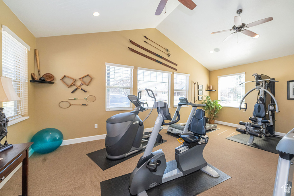 Workout room with baseboards, vaulted ceiling, recessed lighting, and a ceiling fan
