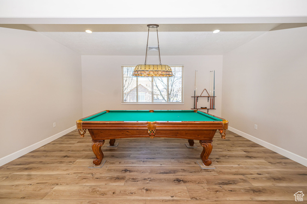 Rec room featuring baseboards, light wood-type flooring, and billiards