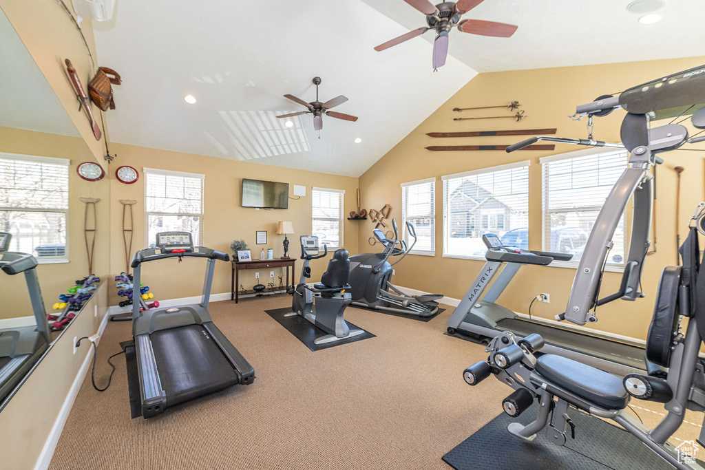 Exercise room featuring baseboards, vaulted ceiling, recessed lighting, and a ceiling fan