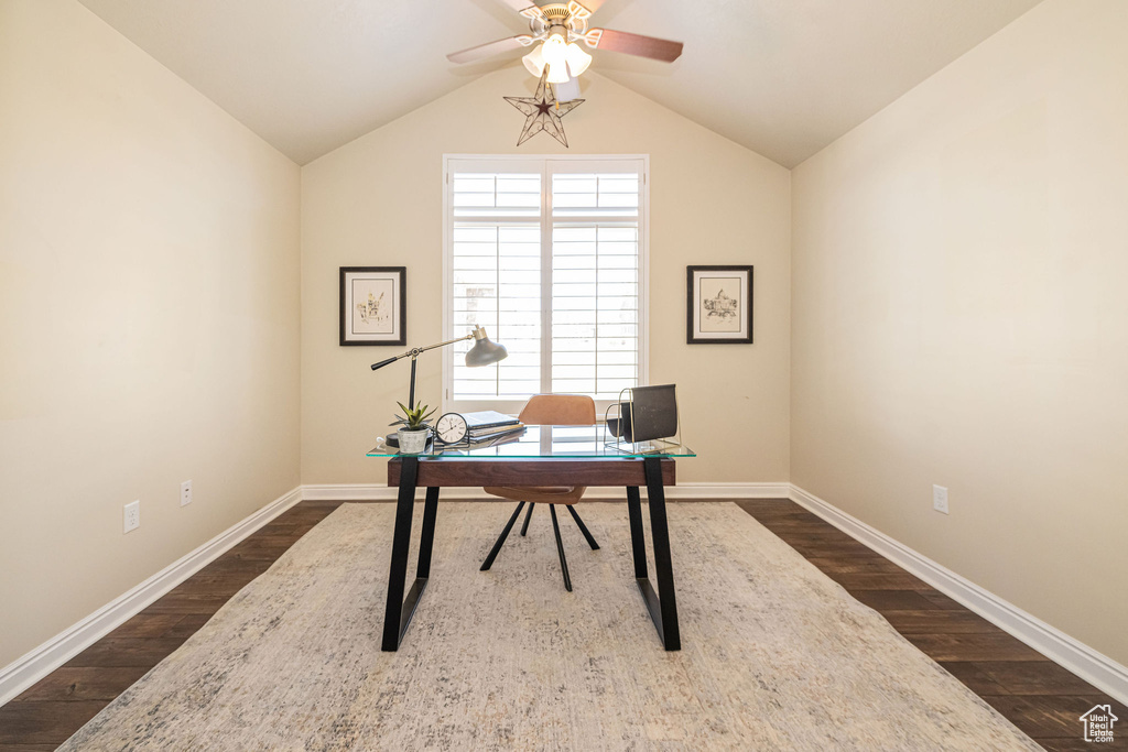 Office featuring baseboards, lofted ceiling, a ceiling fan, and dark wood-style flooring