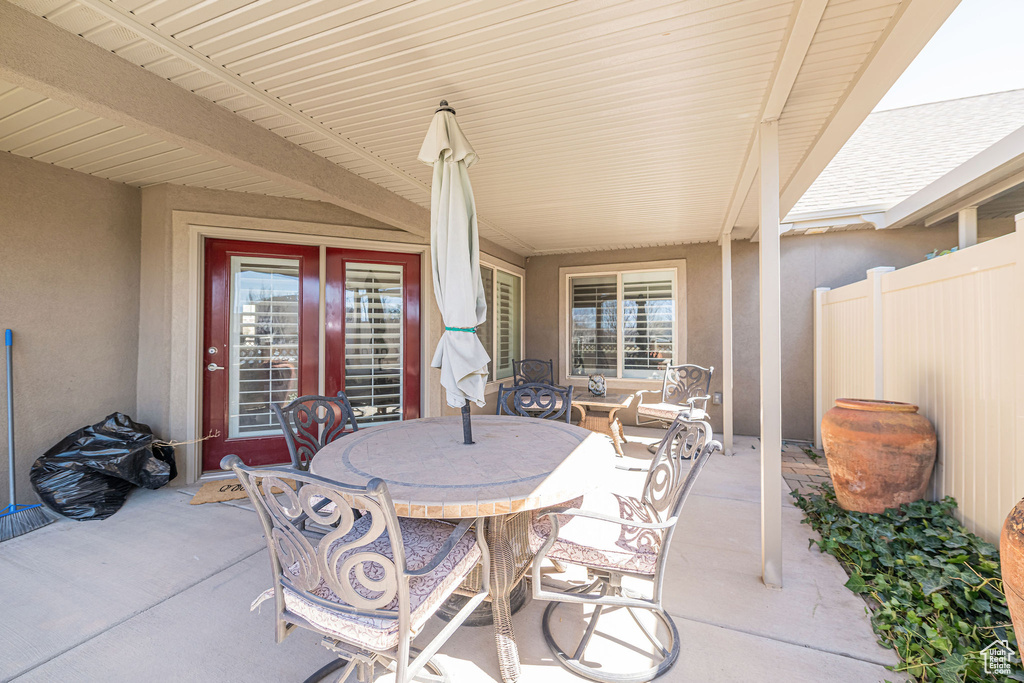 View of patio / terrace with outdoor dining area and fence