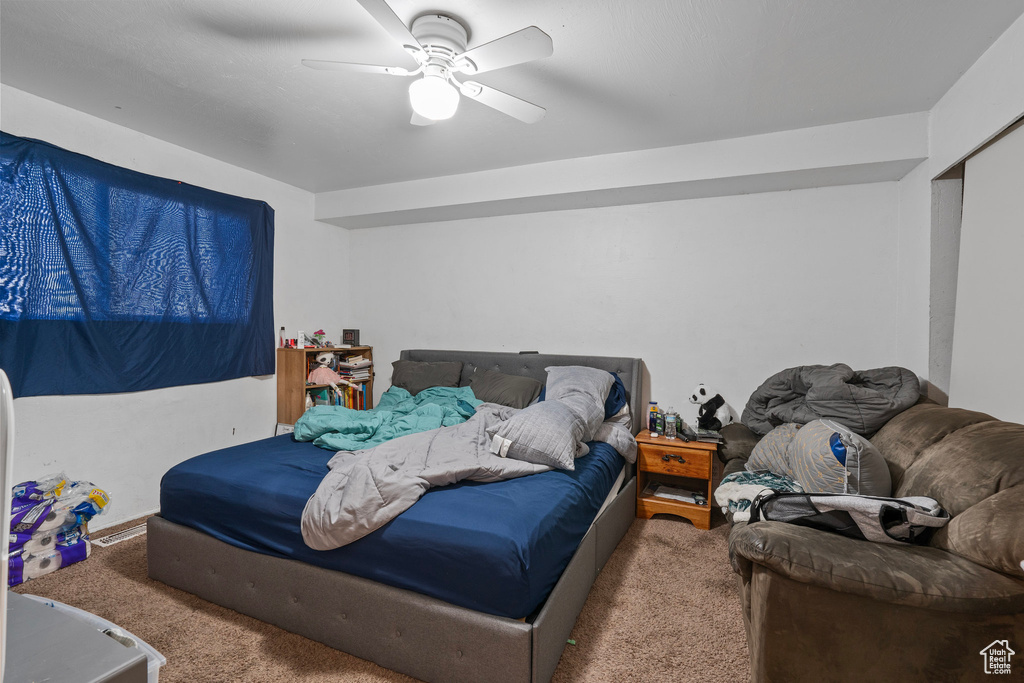 Bedroom with carpet flooring and ceiling fan