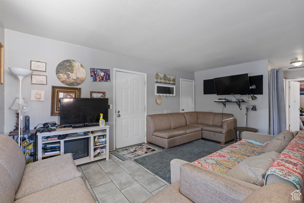 Living room featuring light tile patterned floors