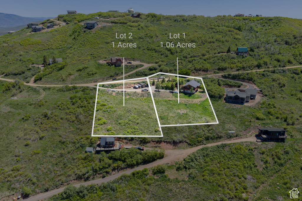 Aerial view of sparsely populated area with property parcel outlined