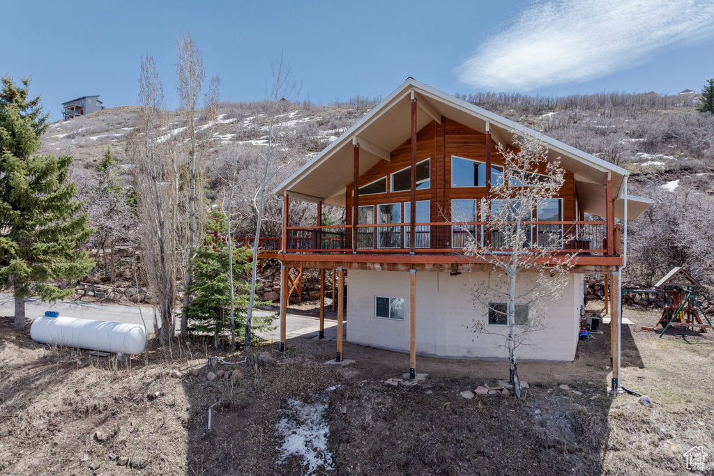 Back of property featuring a deck