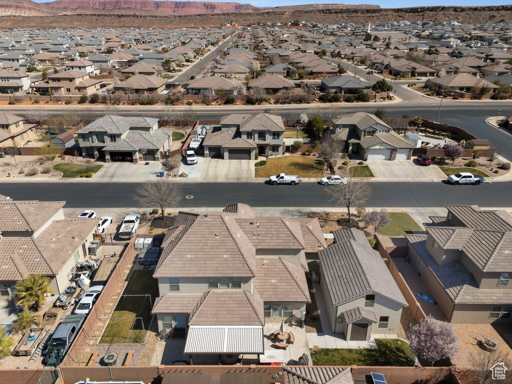 Birds eye view of property featuring a mountain view and a residential view