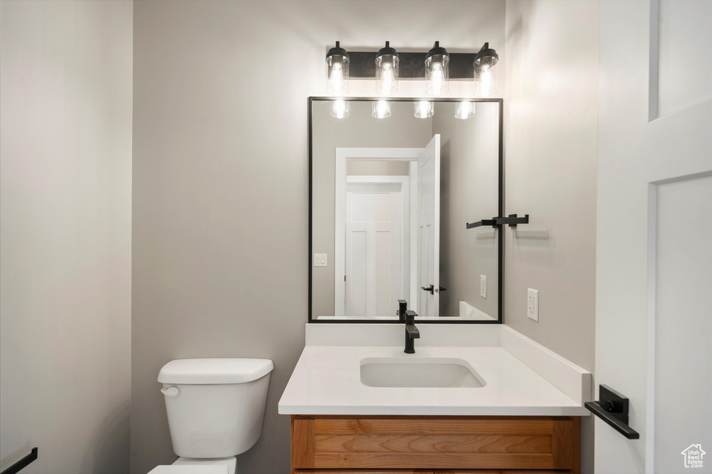 Half bath with toilet and vanity