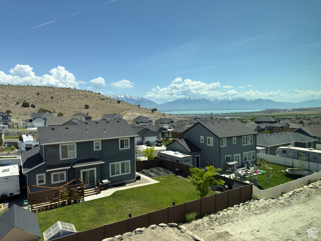 Aerial view of residential area featuring mountains