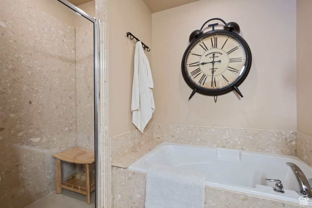 Bathroom featuring a garden tub and walk in shower