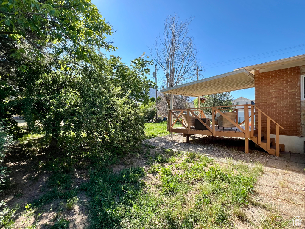 View of yard featuring a deck