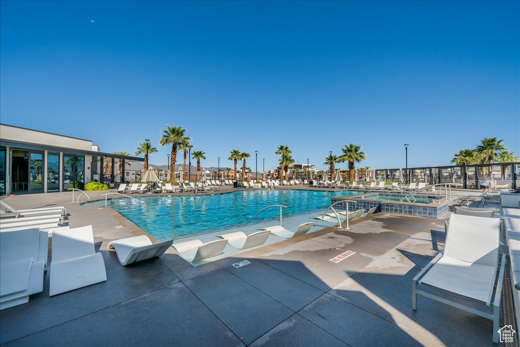 Community pool featuring a patio area