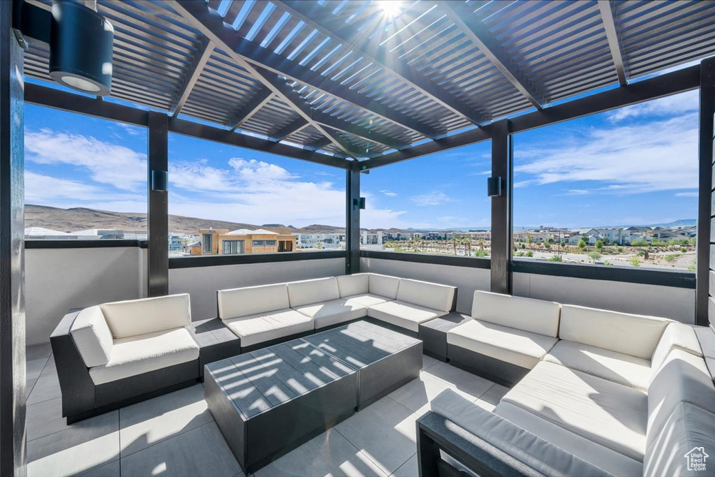 View of patio / terrace featuring an outdoor living space and a pergola