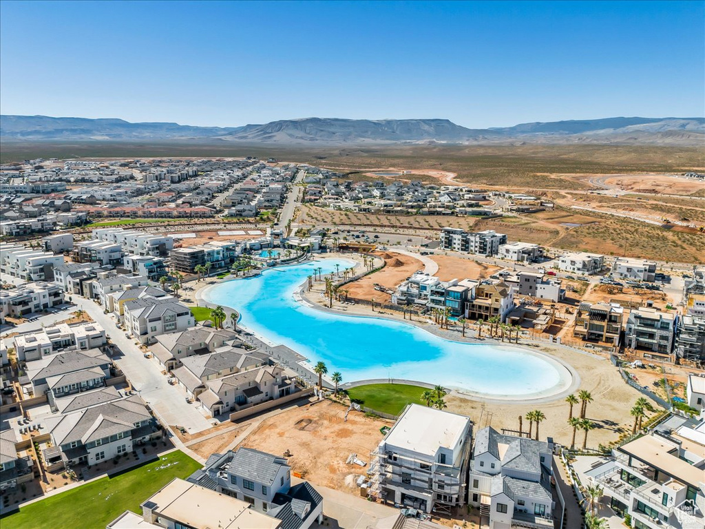 Bird\\\'s eye view of a mountain backdrop and a pool area