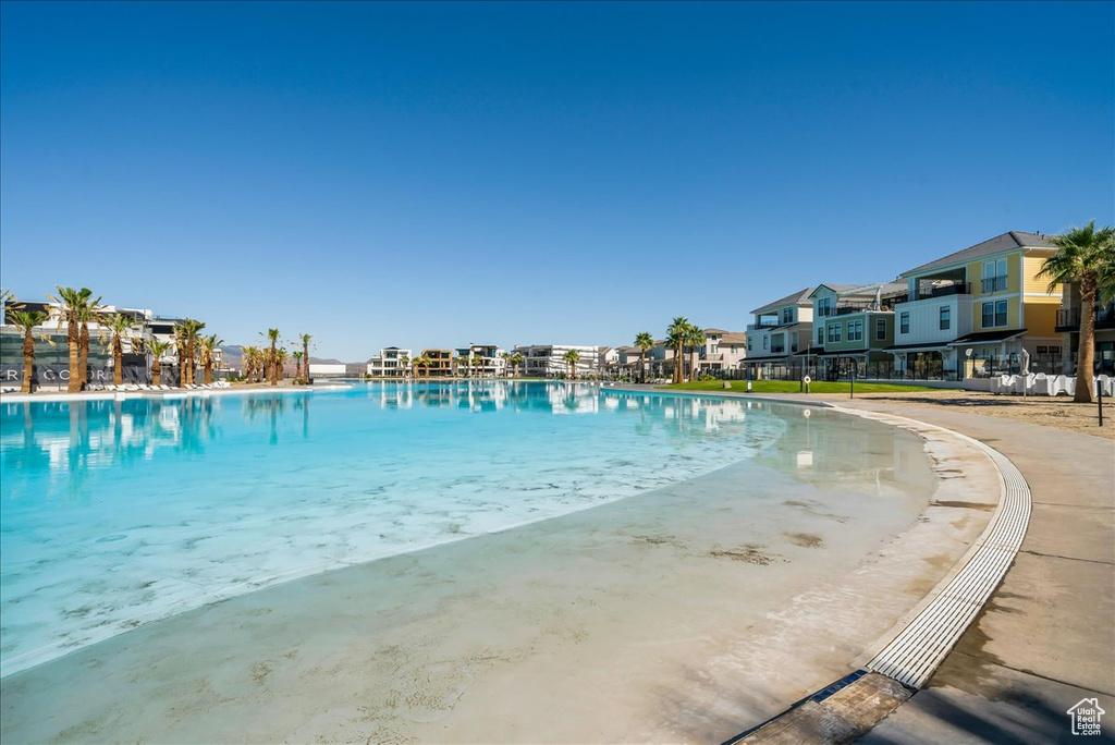 Community pool featuring a residential view