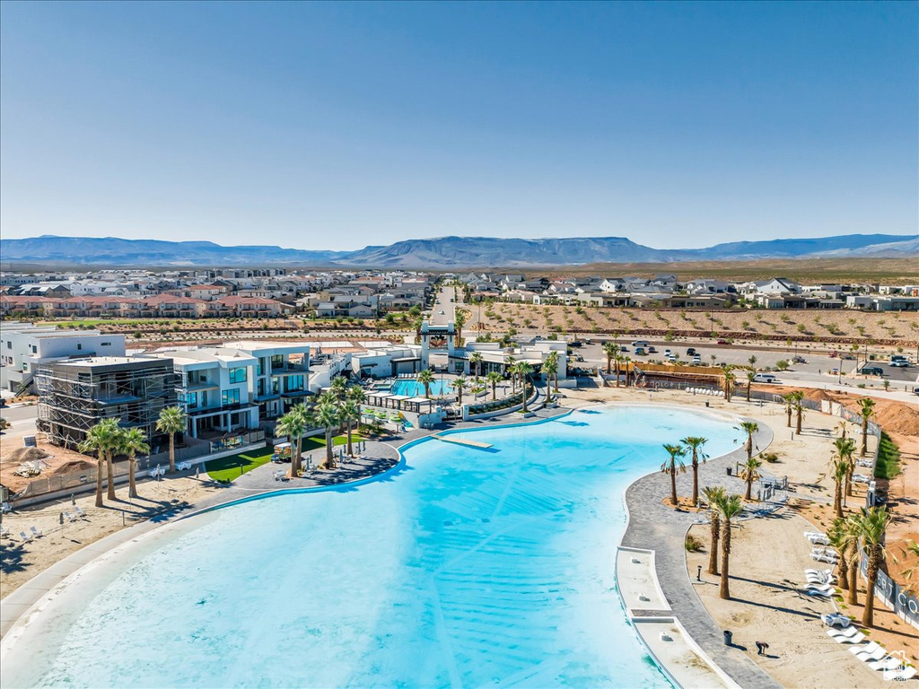 Drone / aerial view of mountains and a pool