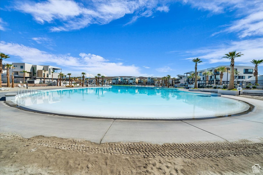 Community pool featuring a residential view
