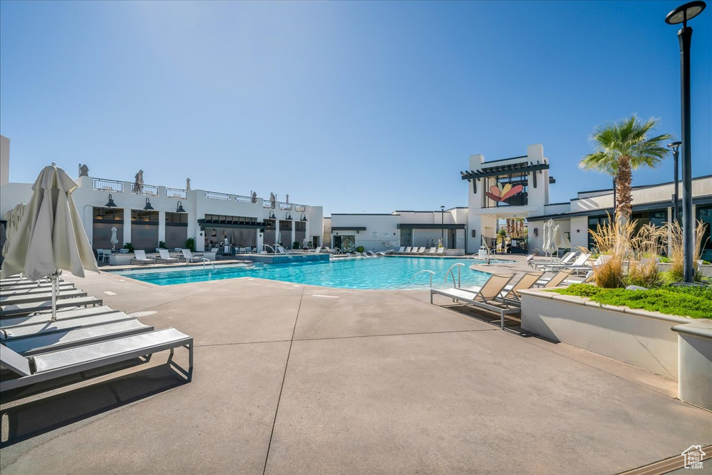 Community pool with a patio area