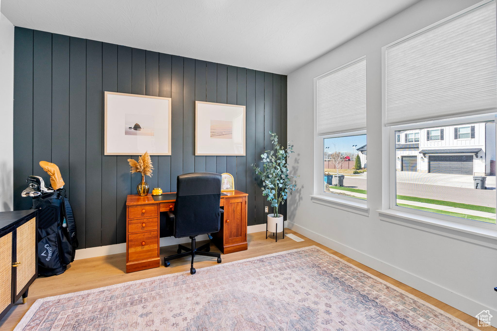 Home office featuring baseboards and wood finished floors