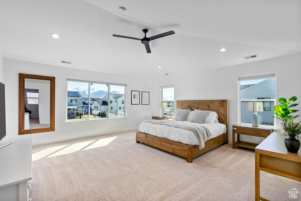 Bedroom with carpet flooring, recessed lighting, and visible vents