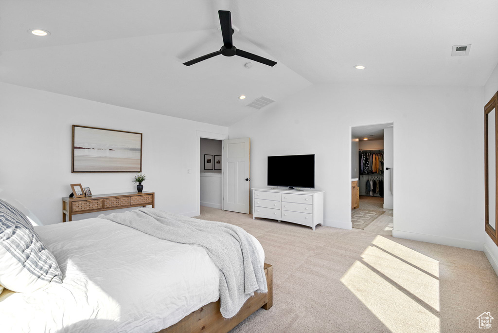 Bedroom with lofted ceiling, visible vents, recessed lighting, and light colored carpet