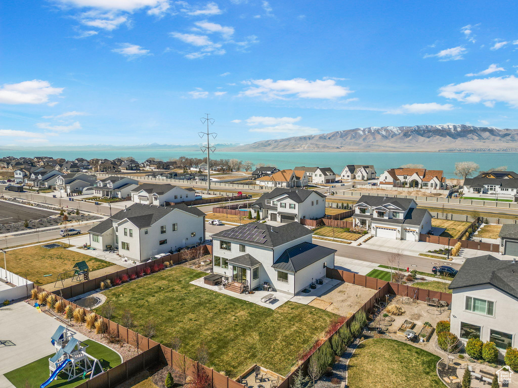 Birds eye view of property featuring a mountain view and a residential view