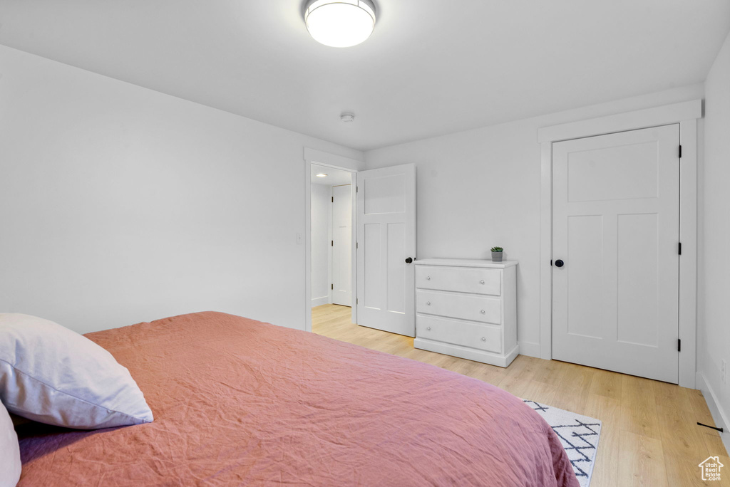 Bedroom featuring baseboards and light wood-style flooring