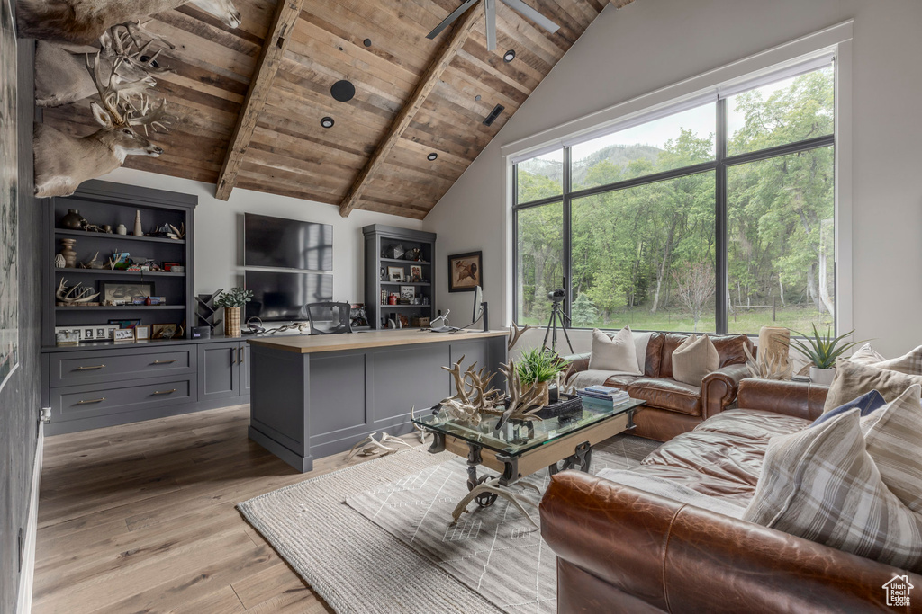 Living room with wooden ceiling and light wood-style floors