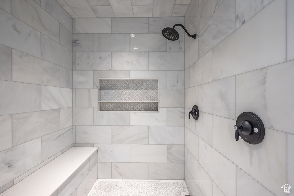 Full bathroom with a tile shower