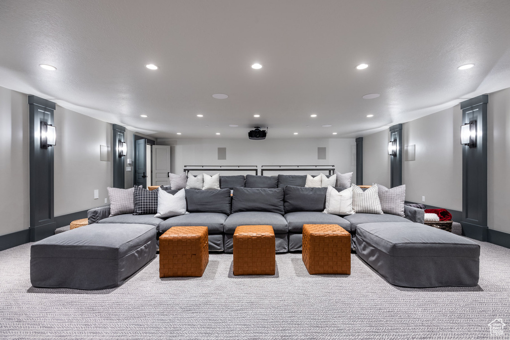 Cinema room featuring carpet floors, recessed lighting, and baseboards